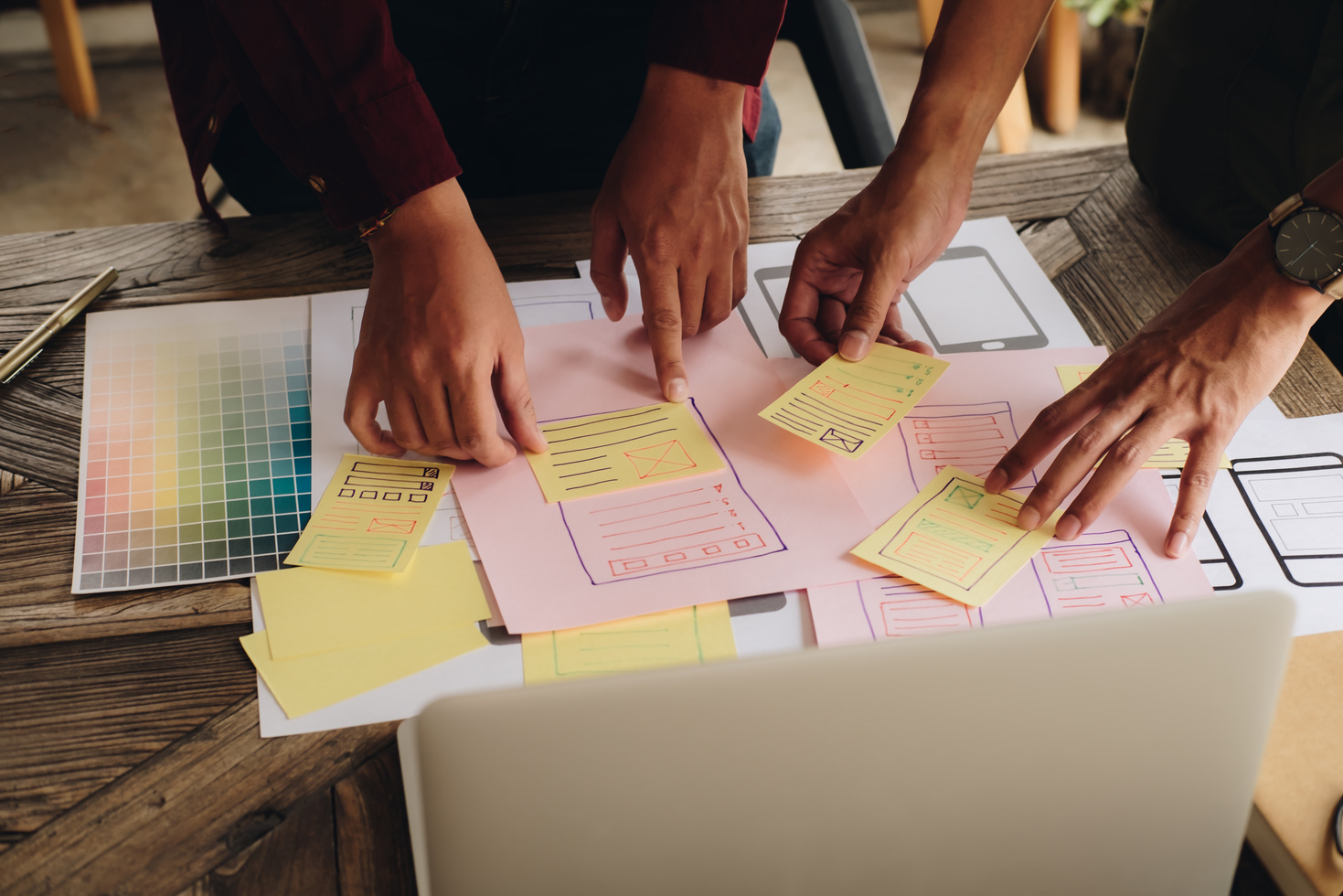 Financial charts, reports, and planning documents reviewed at a table